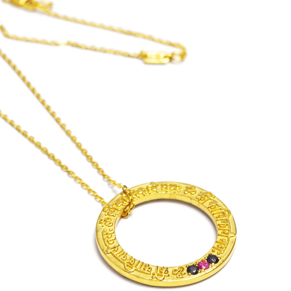Kali Mantra pendant in gold plated sterling silver with ruby and sapphire gemstones from ETERNAL BLISS from the Spiritual Yoga jewelry collection