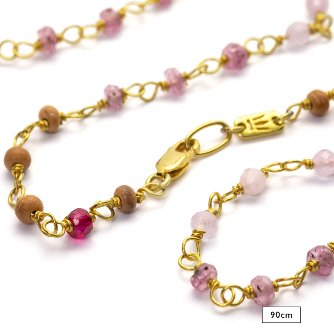 Detail of 90cm gemstone necklace "Sakura" made of high-quality gold-plated sterling silver with ruby, rock crystal, lavender, and sandalwood by Eternal Bliss