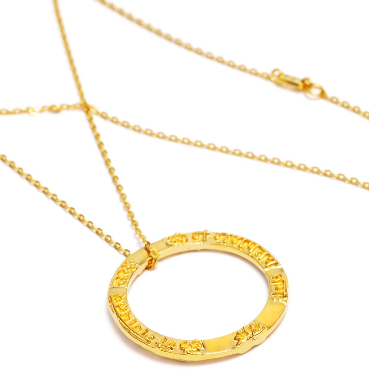 Ring shaped Ganesha Mantra pendant in gold plated sterling silver from ETERNAL BLISS from the spiritual yoga jewelry collection